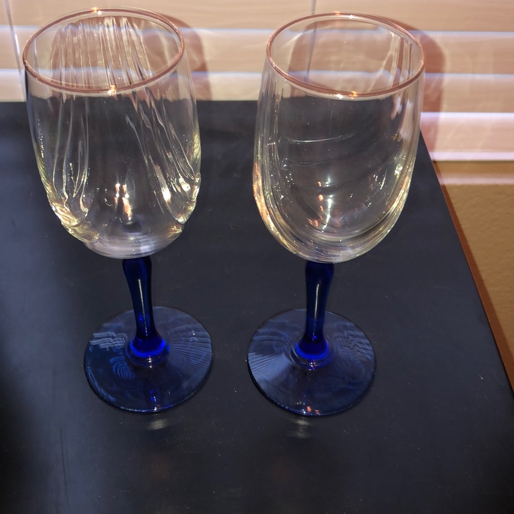 Set of two gold rimmed, blue stem wine glasses